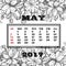 Calendar 2017 on the month of May on the background of blooming apple tree branches