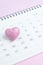 Calendar with cute pink heart shape on 14 February on pink background using as romantic Valentines day concept