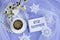 Calendar for December 2: a cup of tea with a decorative snowflake on a lace napkin, the name of the month December in English,