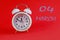 Calendar en March 4: white alarm clock on a crimson background close-up, numbers 04, the name of the month March in English