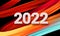 Calendar header 2022 number on colorful abstract color paint brush strokes background. Happy 2022 new year colorful