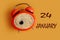 Calendar for January 24: coffee mug in the shape of an orange clock, month name January in English6, numbers 24, yellow