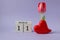 Calendar for March 11: cubes with the number 11 ,the name of the month March in English, a scarlet tulip in a heart vase on a