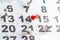 Calendar with numbers marked with white and red push pins. The number of February 14. Background for Valentine`s Day