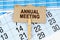 On the calendar and reporting documents is a cardboard plate with the inscription - ANNUAL MEETING
