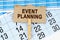 On the calendar and reporting documents is a cardboard plate with the inscription - Event Planning