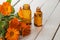 Calendula and bottles with medicines. Concept homeopathy.