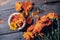 Calendula is homeopathic. Dried organic herbal medicinal calendula on a wooden table.