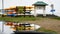 Calf Pasture beach view in rainy day with kayaks storage and reflections in water