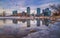 Calgary Skyline Reflecting Into An Icy Bow River