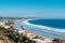 California beaches with a realty near Los Angeles city with a clear blue sky and yellow sand on the coast