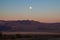 California desert with full moon at early morning right before sunrise, Death Valley, USA