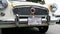 California Historical Vehicle license plate on chrome bumper of Nash Metropolitan vehicle of historic value and interest. Close up