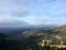 California landscapes nature background. Slowly filling clouds in the mountains. Fog