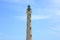 California Lighthouse on blue sky background isolated, Aruba coastline.