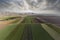 California Row Crops Farm Land Aerial with Cloudy Sky