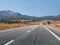 California State Highway 395 with mountain peaks in the distance