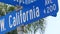 California street road sign on crossroad. Lettering on intersection signpost, symbol of summertime travel and vacations