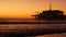 California summertime beach aesthetic, golden sunset. Vivid sky over pacific ocean waves. Santa Monica popular resort