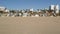 California summertime beach aesthetic, sunny blue sky, sand and many different beachfront weekend houses. Seafront buildings, real