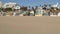 California summertime beach aesthetic, sunny blue sky, sand and many different beachfront weekend houses. Seafront buildings, real