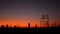 California summertime dusk beach aesthetic, pink sunset. Unrecognizable silhouettes, people play game with ball on