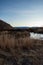 California valley view with river and snowy Sierra Nevada mountain range