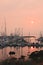 California wildfires create a smoky early morning sunrise, with beautiful reflections in the open water of Monterey Bay, CA.