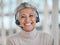 Call center, mature and face of woman with headphones in office for telemarketing, support or contact. Smile, portrait