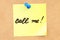 Call me! Text on a sticky note pinned to a corkboard. 3D rendering