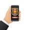 Call police app on smartphone screen. Police badge and emergency call button. Hand holding smartphone with police application