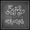 Calligraphy lettering of Enjoy the little things in white in mono line style on blackboard background