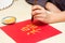 Calligraphy Master writing Golden character Fu means Blessing, Fortune, Luck. Traditional decoration Chinese New Year