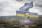 calls for peace text quote on wooden signpost outdoors on nato colored flag, ukrainian flag and russian flags