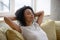 Calm african american woman with hands behind head relaxing.