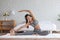 Calm of Asian woman in sportwear stretching muslce to warm up breathing and meditation with yoga at home.Healthy female doing yoga