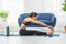 Calm of Asian woman in sportwear stretching muslce to warm up breathing and meditation with yoga at home.Healthy female stretching