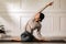 Calm of Asian woman in sportwear stretching muslce to warm up breathing and meditation with yoga at home,Healthy woman doing yoga