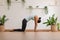 Calm of Athletic Asian woman in sportwear practice yoga Cat Cow pose to breathing and meditation at home,Healthy woman doing yoga