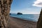 calm azure sea and volcanic rocky shores. Small waves on water surface in motion blur. Nature summer ocean sea beach