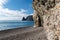 calm azure sea and volcanic rocky shores. Small waves on water surface in motion blur. Nature summer ocean sea beach