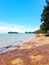 Calm beach scenery with Kamat Island or Pulau Kamat in Pengkalan Balak, Kuala Sungai Baru, Melaka, Malaysia