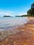 Calm beach scenery with Kamat Island or Pulau Kamat in Pengkalan Balak, Kuala Sungai Baru, Melaka, Malaysia