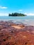 Calm beach scenery with Konet Island or Pulau Konet in Kuala Sungai Baru, Melaka, Malaysia