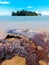 Calm beach scenery with Konet Island or Pulau Konet in Kuala Sungai Baru, Melaka, Malaysia