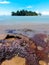 Calm beach scenery with Konet Island or Pulau Konet in Kuala Sungai Baru, Melaka, Malaysia