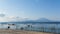 Calm beach and seaweed farm with the Gunung Agung Volcano in the background in Nusa Penida, in Bali, Indonesia.