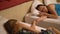 Calm beautiful young women holding hands and sleeping in hotel room