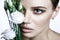 Calm Beauty Fashion Model Woman face. Portrait with white Rose flower.