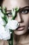 Calm Beauty Fashion Model Woman face. Portrait with white Rose flower.